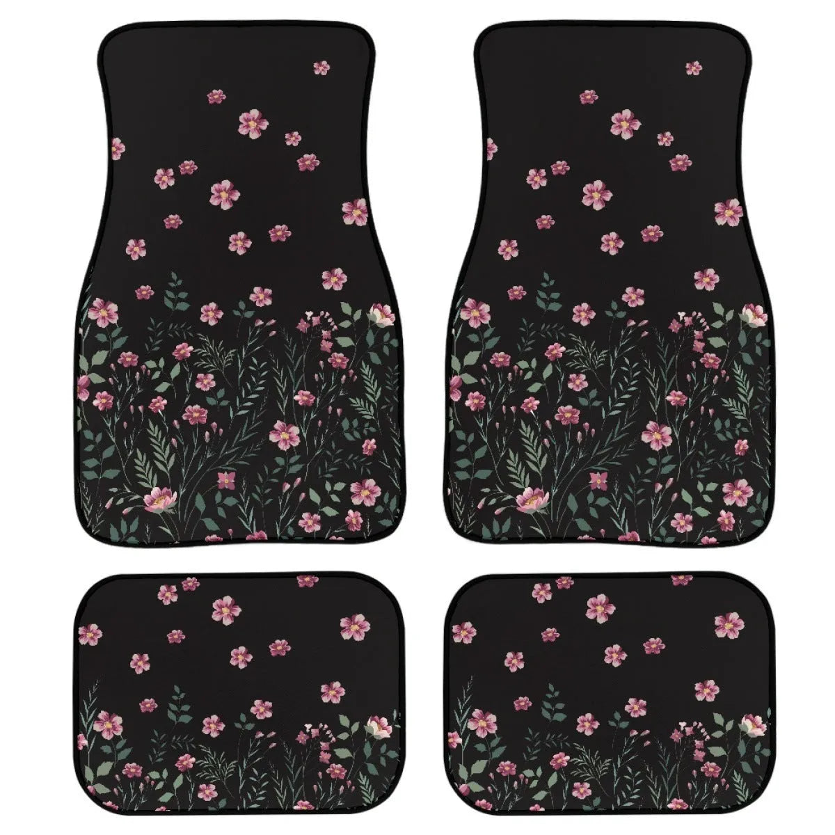 Set of four black printed rubber car floor mats with textured surface, showing thickness.