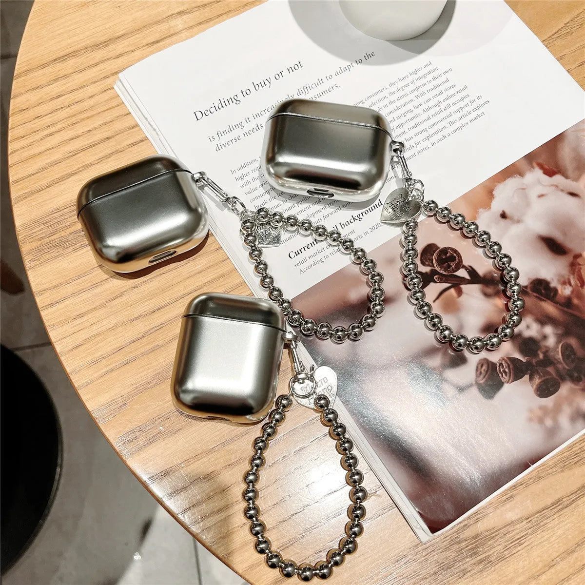 Matte plating AirPods protective case with electroplated detailing and bracelet element