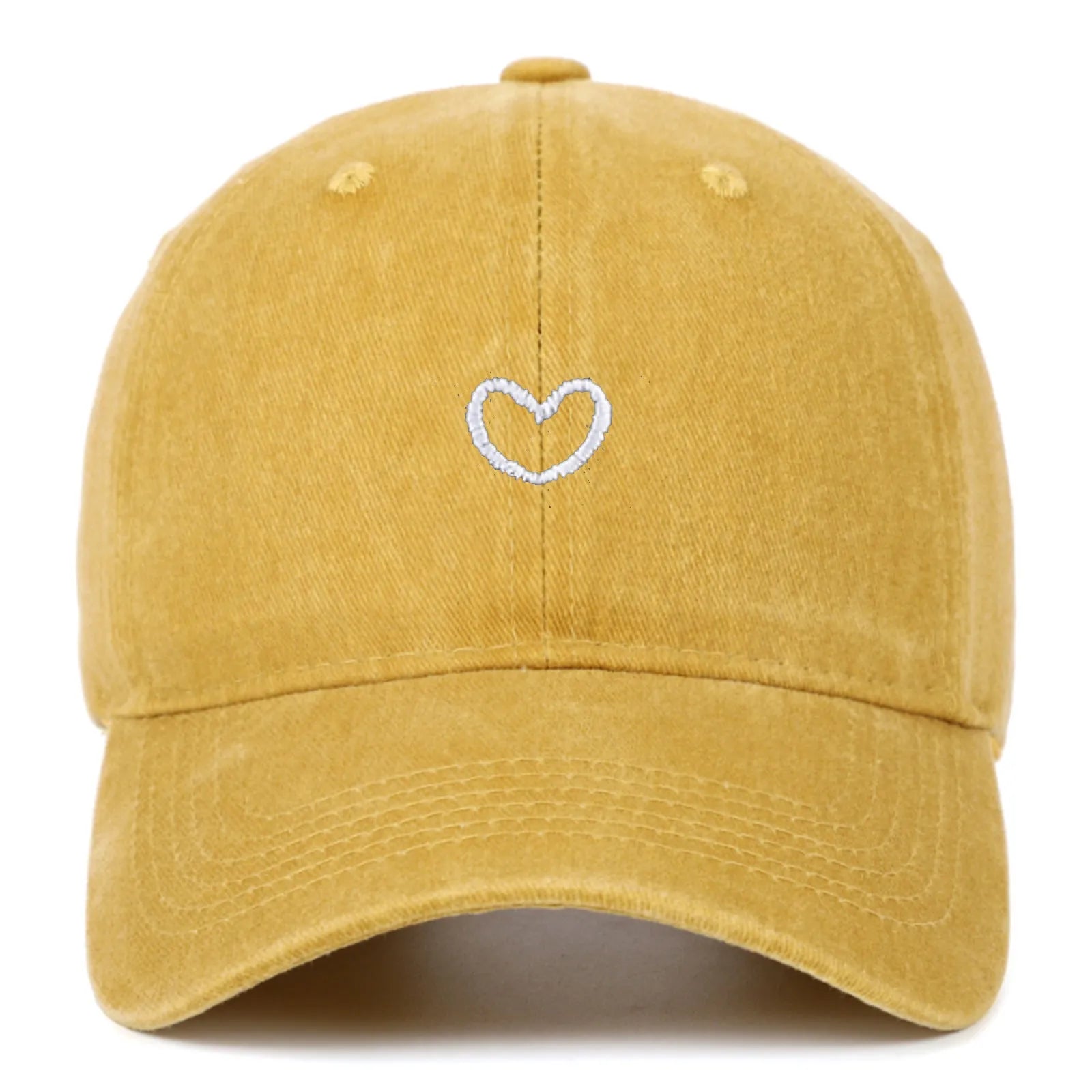 Adjustable cotton baseball cap featuring a distressed embroidered love heart on the front, shown in a selection of colours.