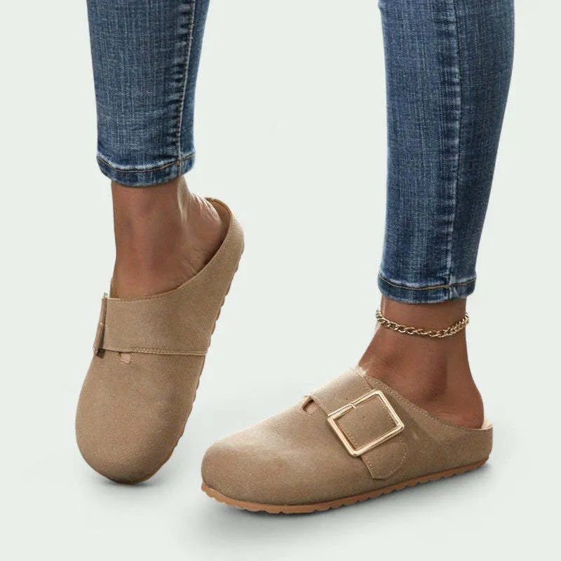 Women's closed toe canvas slipper in apricot colour showing low top design and elasticated heel.