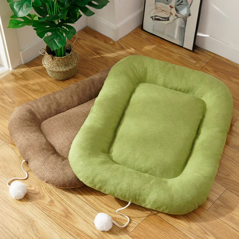 Brown and green universal dog cushion shown in four sizes for kennel sleeping and summer cooling