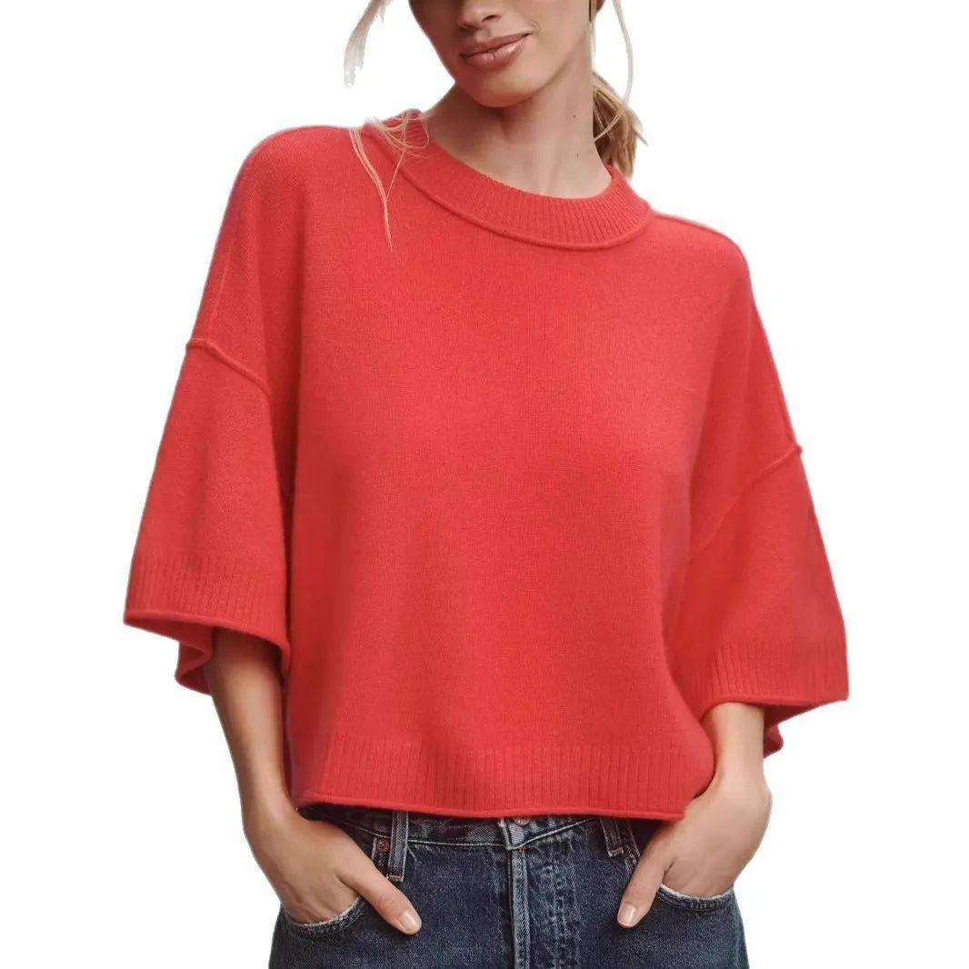 Red cropped t-shirt with exposed navel design and short sleeves on mannequin