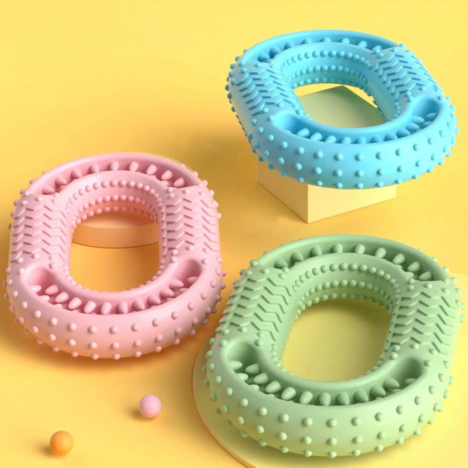 Blue O-ring shaped dog chewing toy for large breed aggressive chewers on a plain background