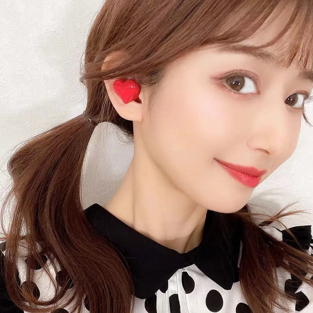 Heart-shaped wireless Bluetooth headphones in red and pink colour options