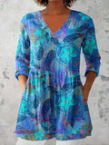 Women's slim-fit retro printed long-sleeved top in a solid colour on a hanger.