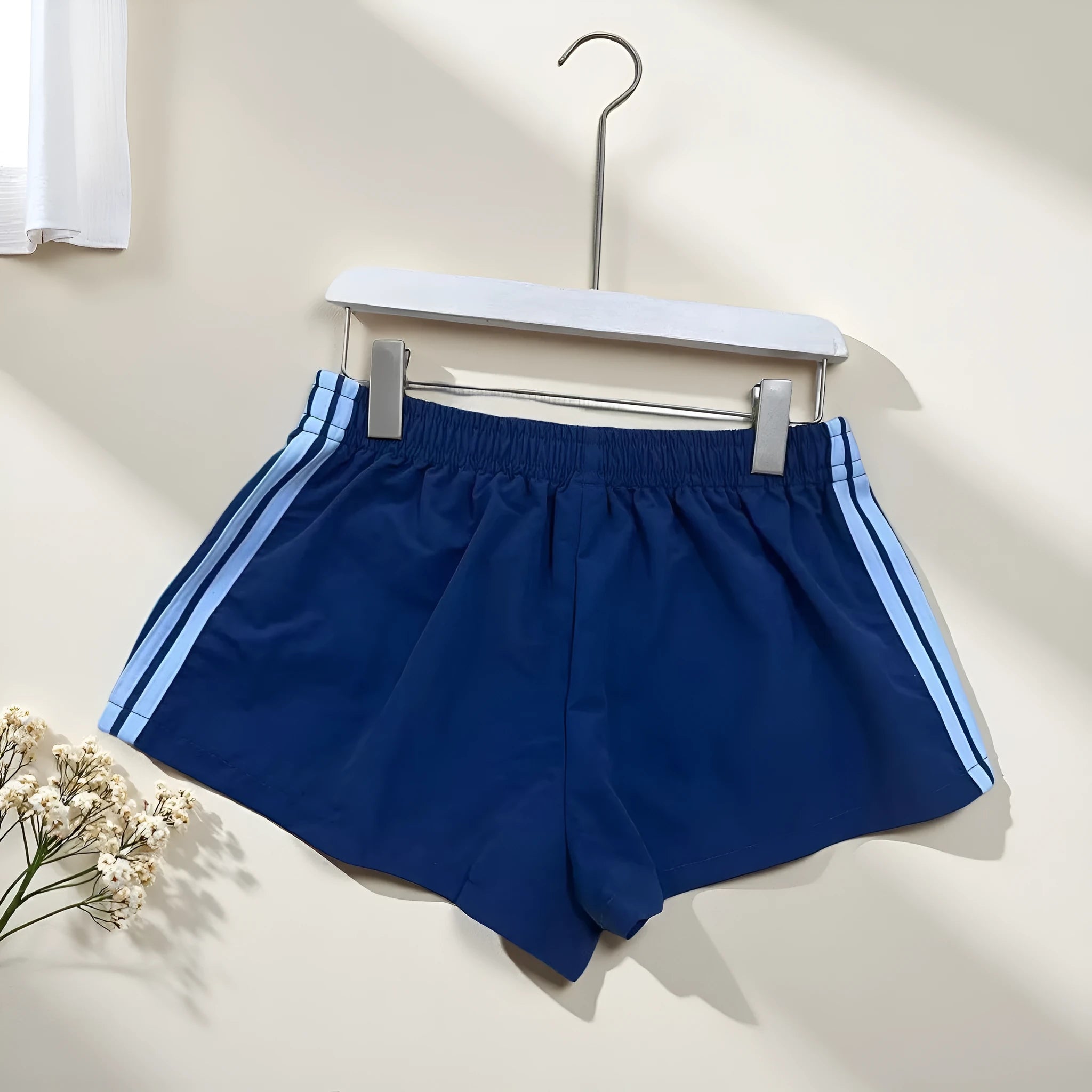 Men's navy blue nylon sport shorts with high-waist elastic waistband