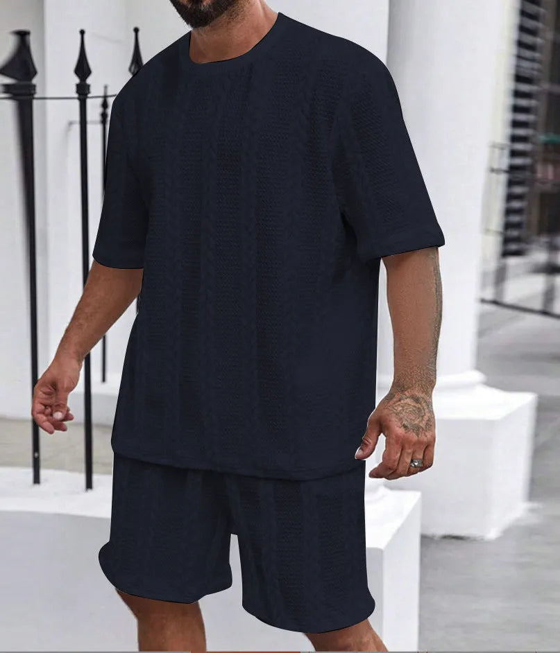 Men's knitted jacquard short sleeve pullover and shorts set in a solid colour on a hanger.