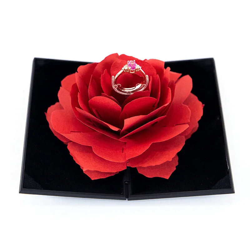 Red heart-shaped rotating plastic ring box for jewellery presentation