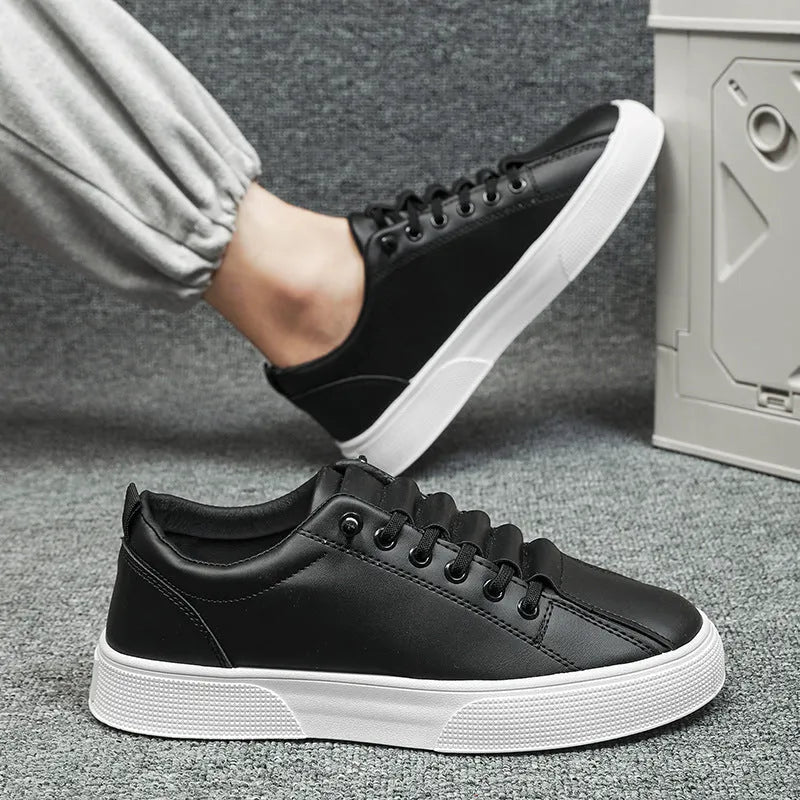 Men's black and white low top sports shoes with synthetic leather upper and PVC sole