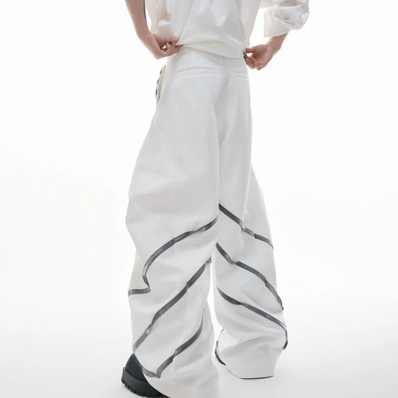 Men's black polyester trousers with metal striped rivet pleats and three-dimensional tailoring.