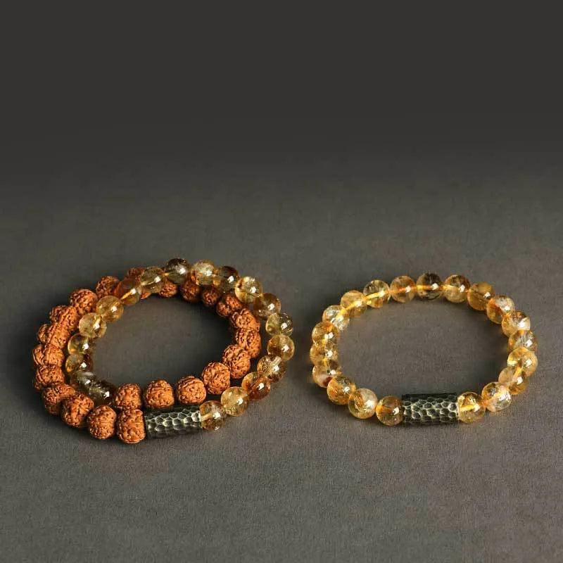 Handcrafted Barbie tan yellow tower crystal double ring bracelet on wrist.