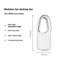 White bladeless tower fan with touch controls and remote on wooden desk