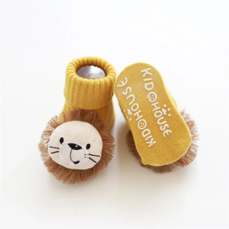 Cotton baby floor socks in a pink bow pattern, shown on an infant's feet.