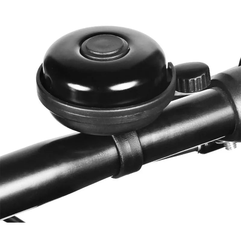 Black ABS plastic bicycle bell with 58mm diameter on a mountain bike handlebar fixture