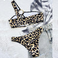 Women's leopard print and polka dot bikini set with top and shorts on a mannequin.