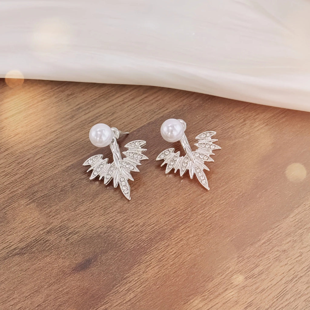 Silver ladies backward-hanging wing pearl earrings with diamond setting on alloy base