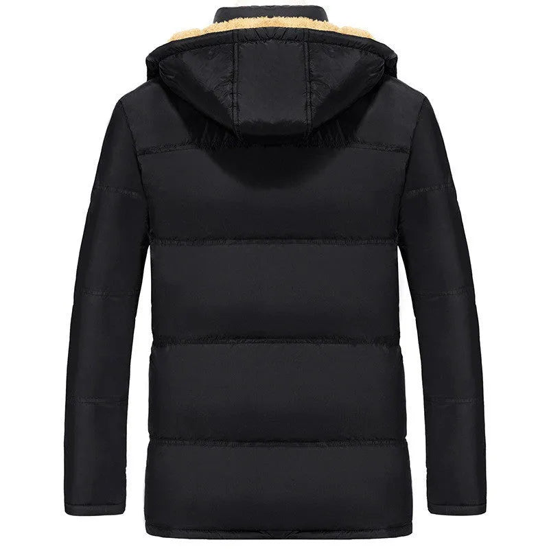 Men's black velvet padded jacket with hood and double-breasted button front, shown on a model.