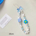 Colourful beaded mobile phone lanyard with a blue resin flower charm on a hand strap.