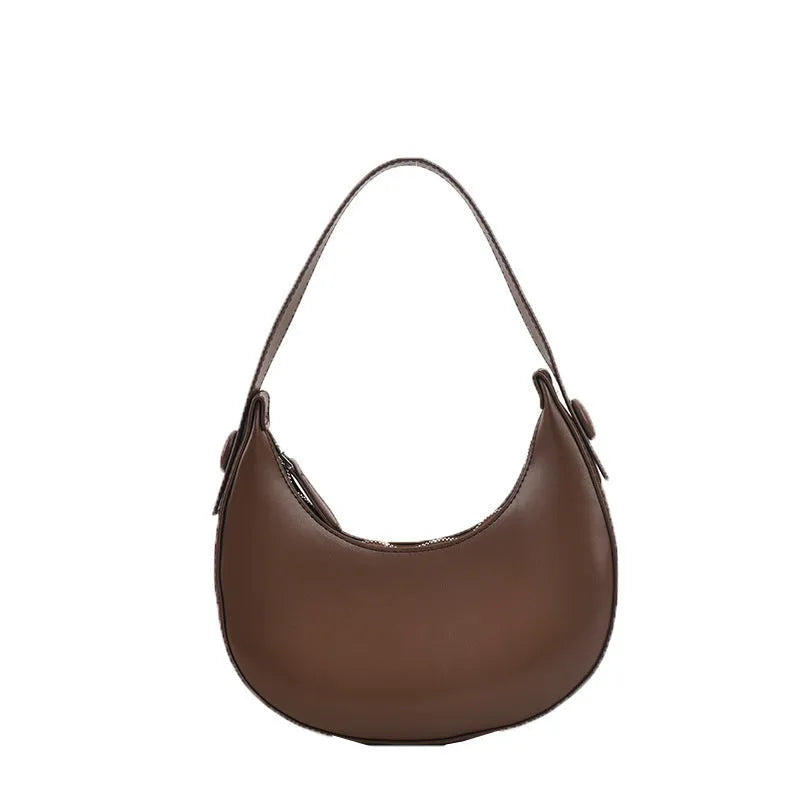 Women's retro dumpling-shaped shoulder bag in PU leather showing internal zipper pocket.