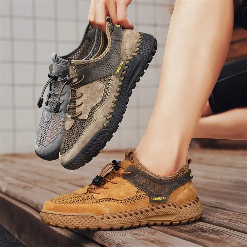 Men's grey suede low-top trainers with elastic band and hand-stitched rubber sole.