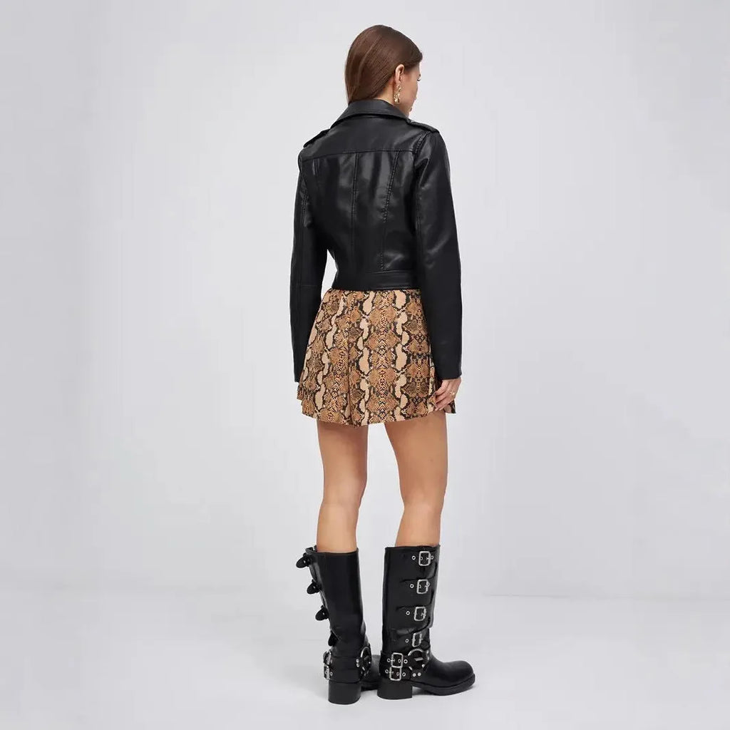 Black women's street fashion PU imitation leather coat on a hanger
