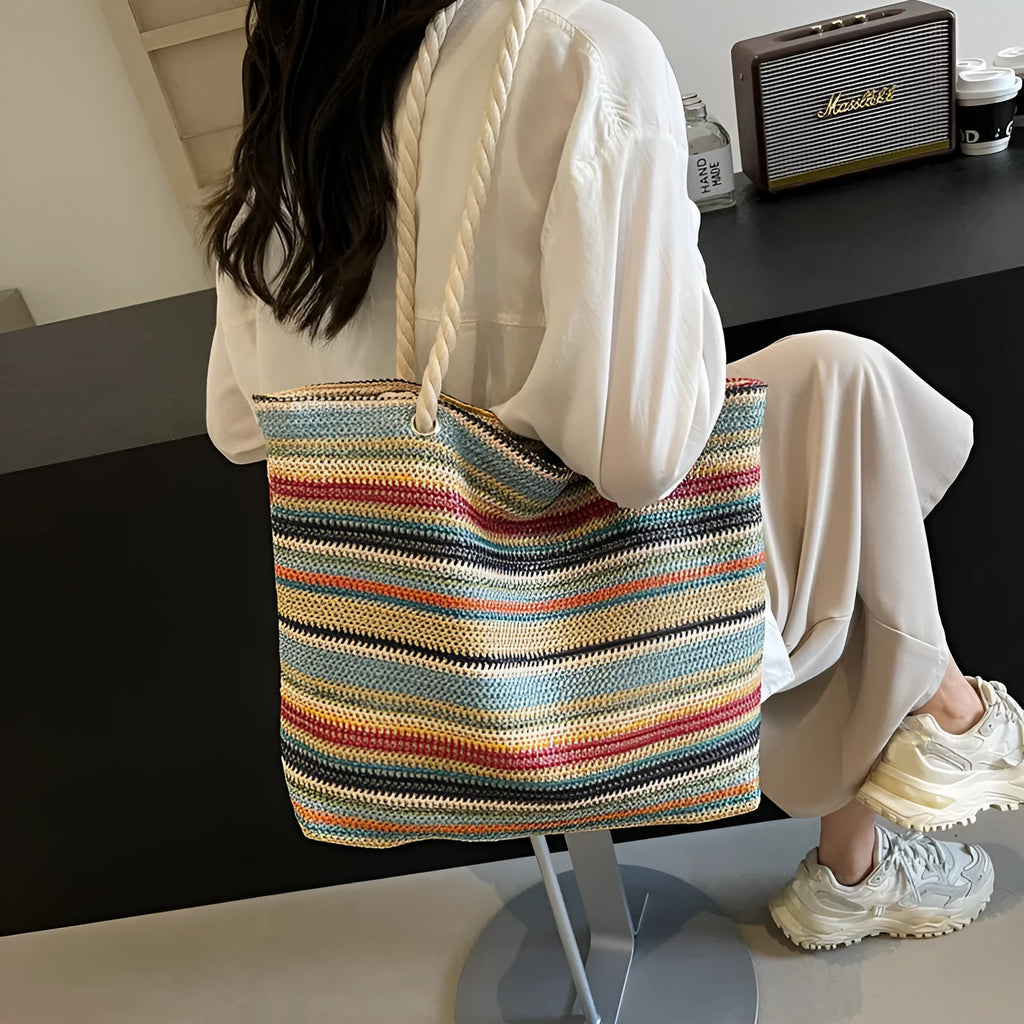 Blue straw and nylon woven large shoulder bag with polyester lining.