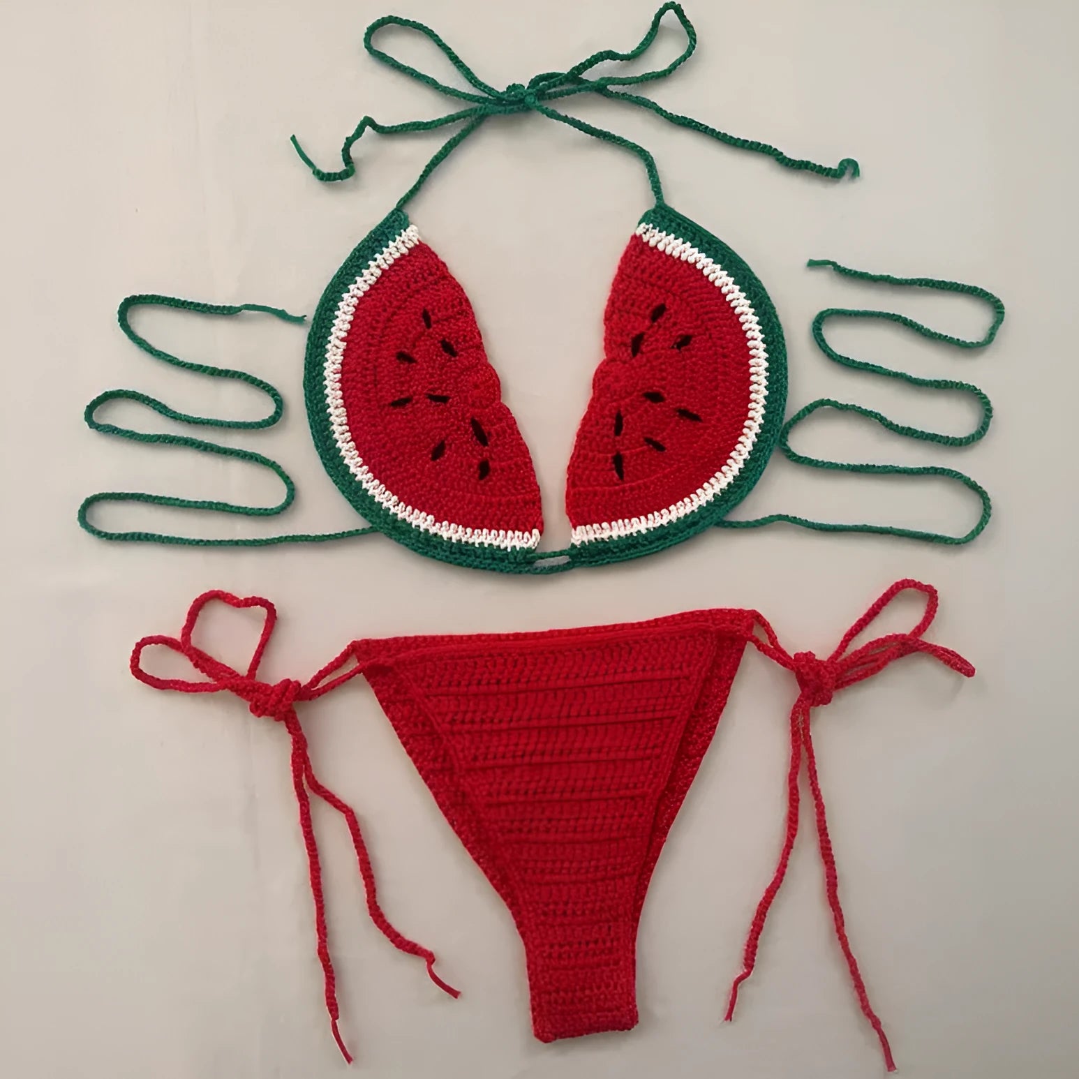 Handmade crocheted two-piece bikini set in mixed colour with lace-up shoulder straps on a model
