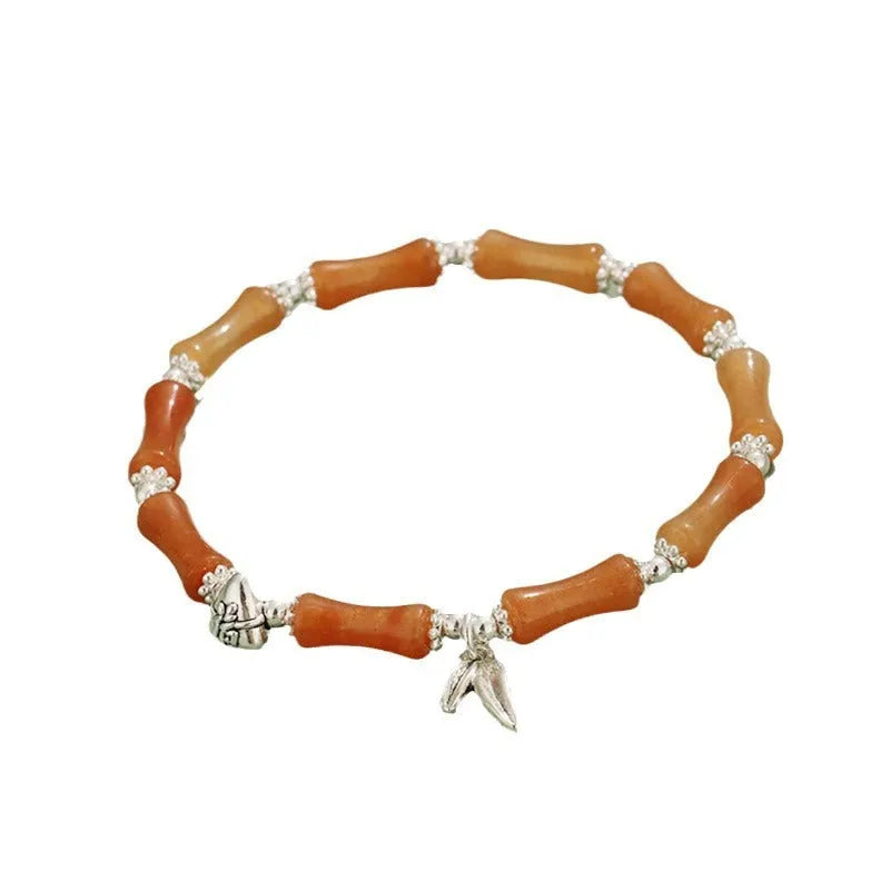 Green aventurine bamboo strawberry crystal bracelet with electroplated finish on adjustable elastic cord