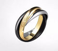 A set of two silver U-shaped geometric couple's rings, one with full diamonds and one plain, on a jewellery display.