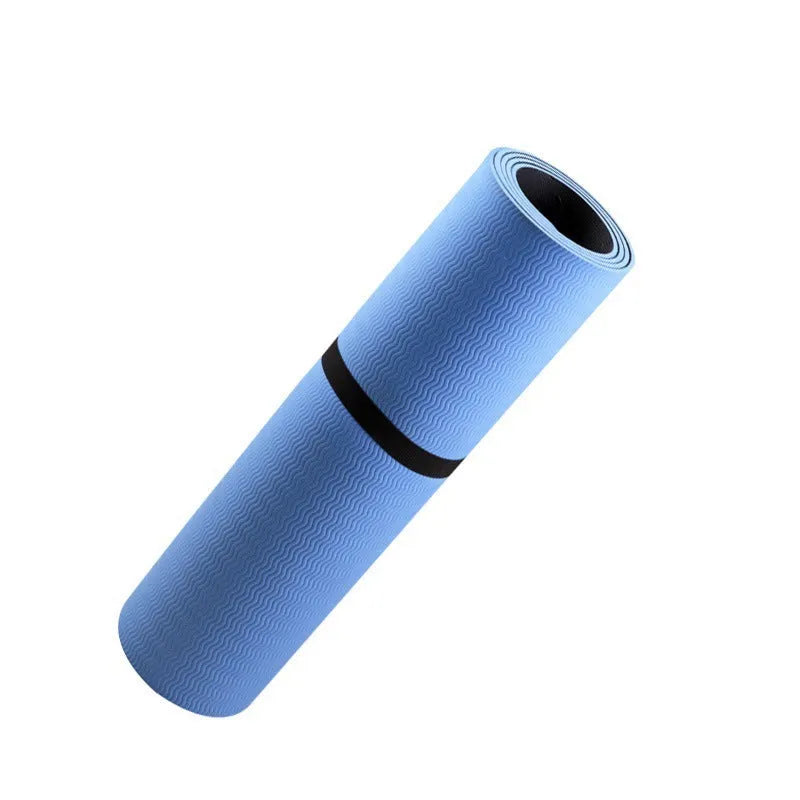Blue yoga mat with plant patterns, showing grounding wire and non-slip texture.