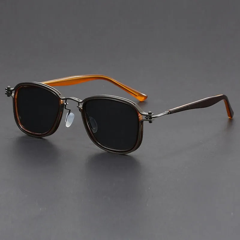 Retro style square frame sunglasses with metal and plastic construction in a black gold full gray colour.