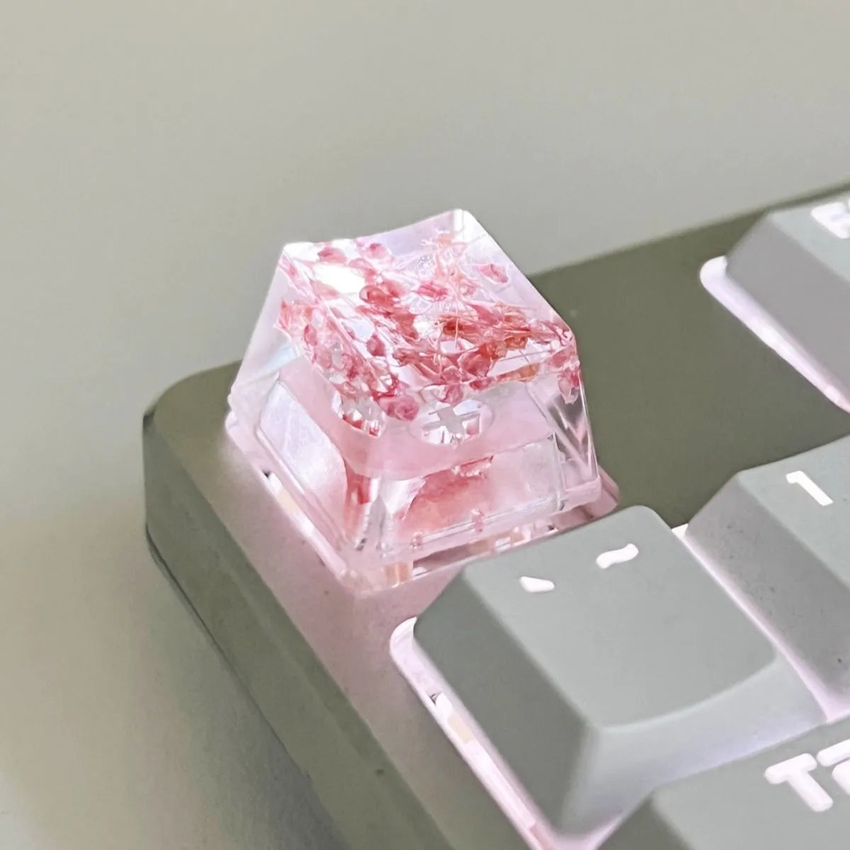 Transparent resin keycap with glitter particles creating starry night effect for mechanical keyboards