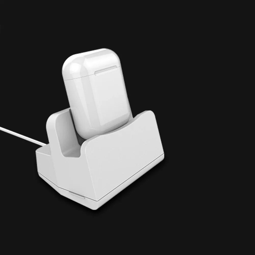 White headphone charging base with fashionable last design on wooden surface