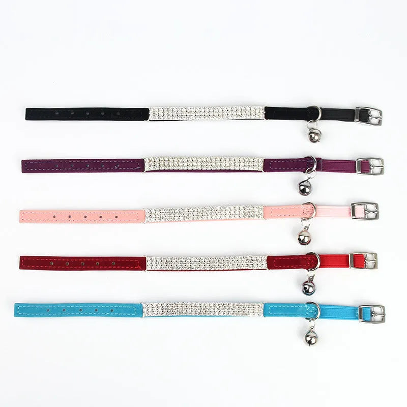 Adjustable velvet cat collar with rhinestones in red, blue, purple, black, and pink colour options.