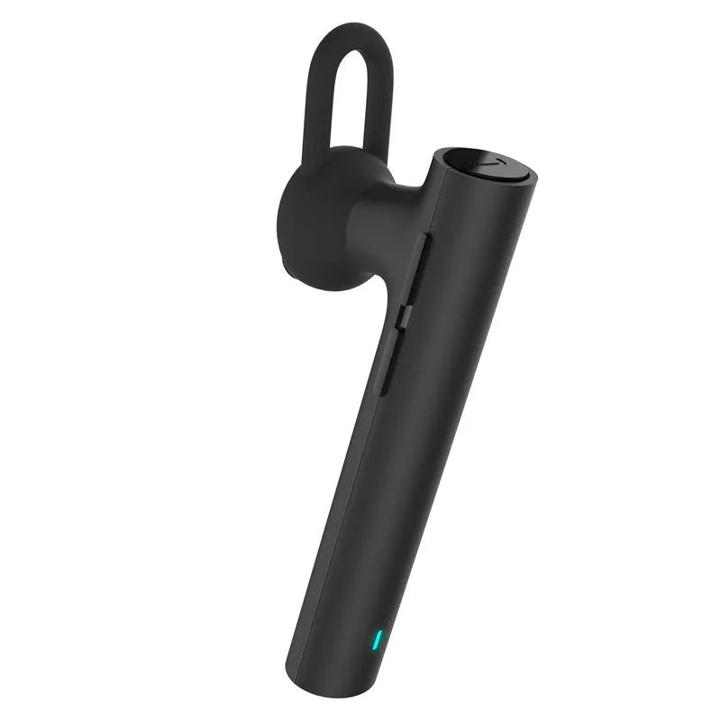 Compact black and white wireless Bluetooth headset for hands-free calls, shown next to a size scale.