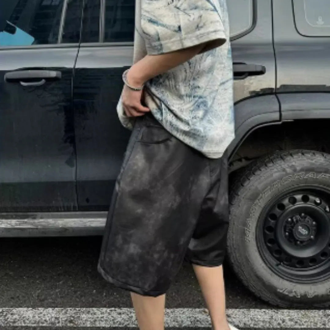 Men's loose fit round neck T-shirt with a printed Korean style design on solid colour fabric.