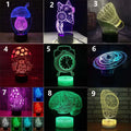 3D LED desk lamp with colourful acrylic design and remote control on wooden desk