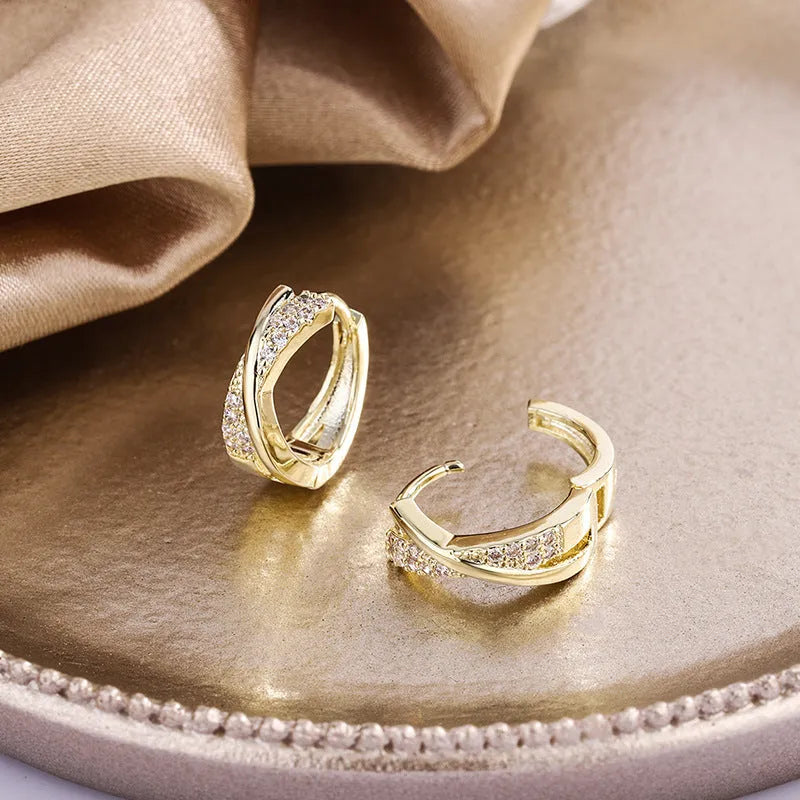 Geometric shape earrings with zircon detail and 14K yellow gold finish on copper