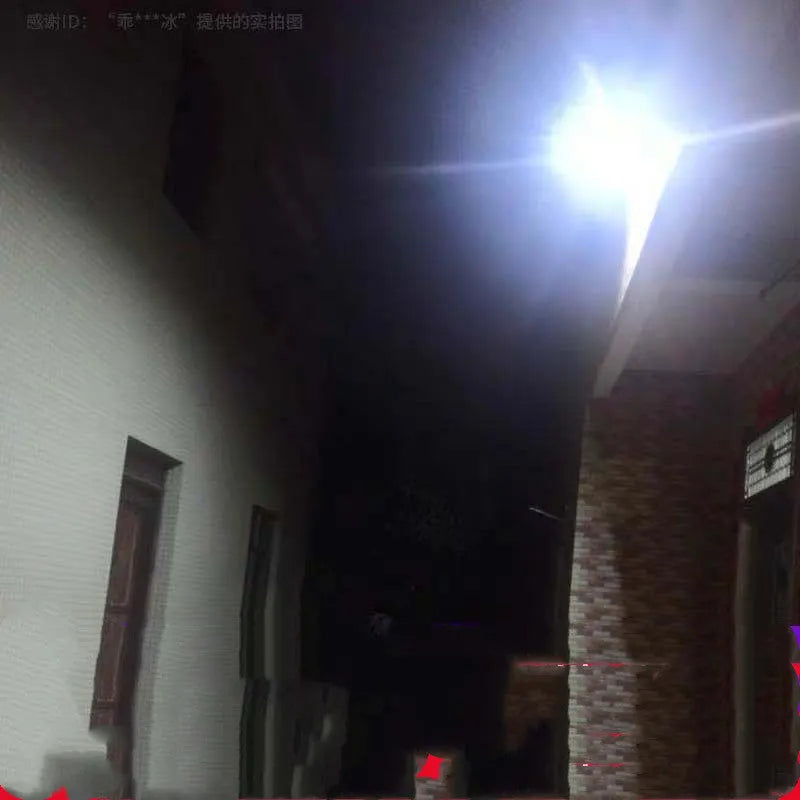 Black solar-powered LED flood light for outdoor garden and security use with remote control.