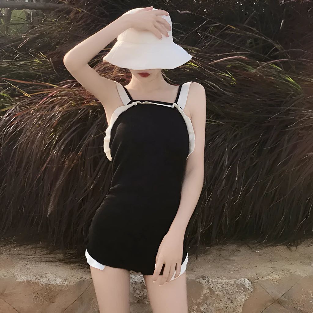 Conservative women's one-piece swimsuit with slingback straps in nylon fabric showing colour options