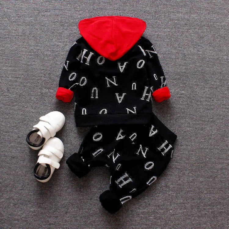 Red and white children's long sleeve two-piece clothing set made from polyester and vinylon fabric.