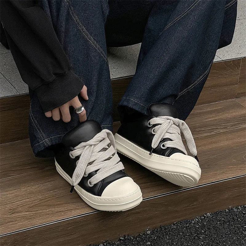 Men's black leather slip-on casual shoes with round toe and flat rubber sole