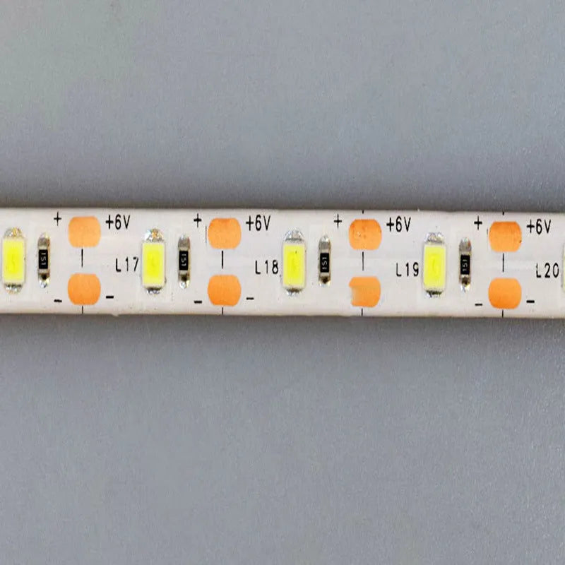 Flexible USB LED light strip bent into a curve, showing individual beads and touch control pad.