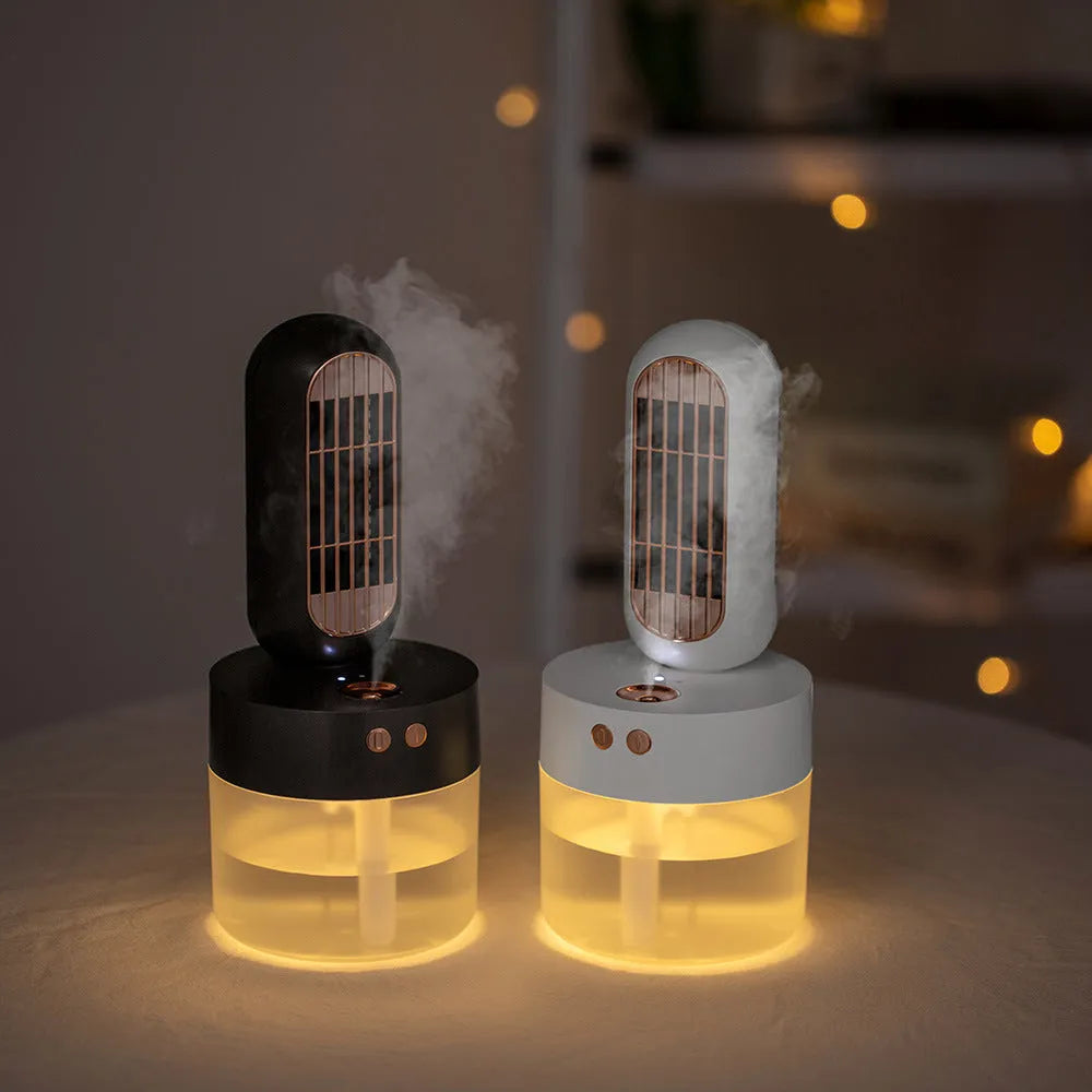 Small black and white portable humidifier fan with side-to-side head shaking feature and charging cable
