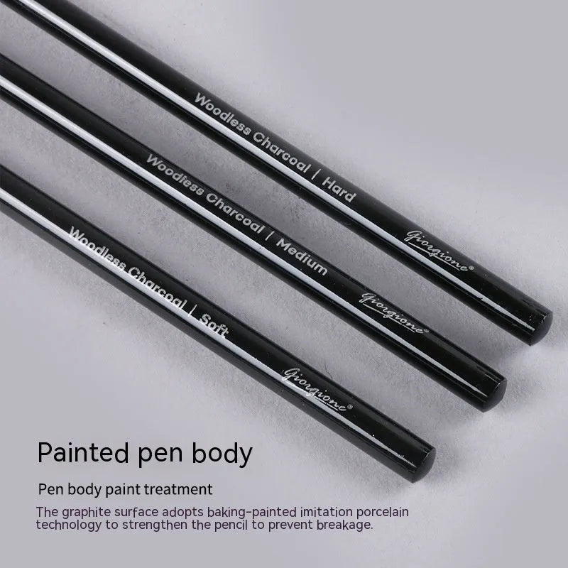 Set of graphite and carbonized wooden pencils on a suction card packaging.