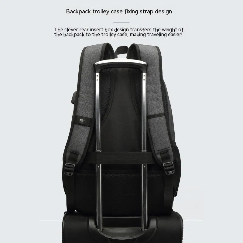 Grey lightweight backpack with USB charging port and trolley strap, showing dimensions 32cm x 15cm x 46cm.