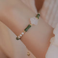 Chinese style bamboo joint bracelet with shell pearls, Hetian jade, and copper connectors