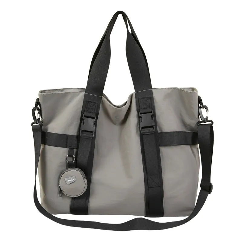Grey Oxford cloth men's travel shoulder bag showing main compartment and detachable coin purse.