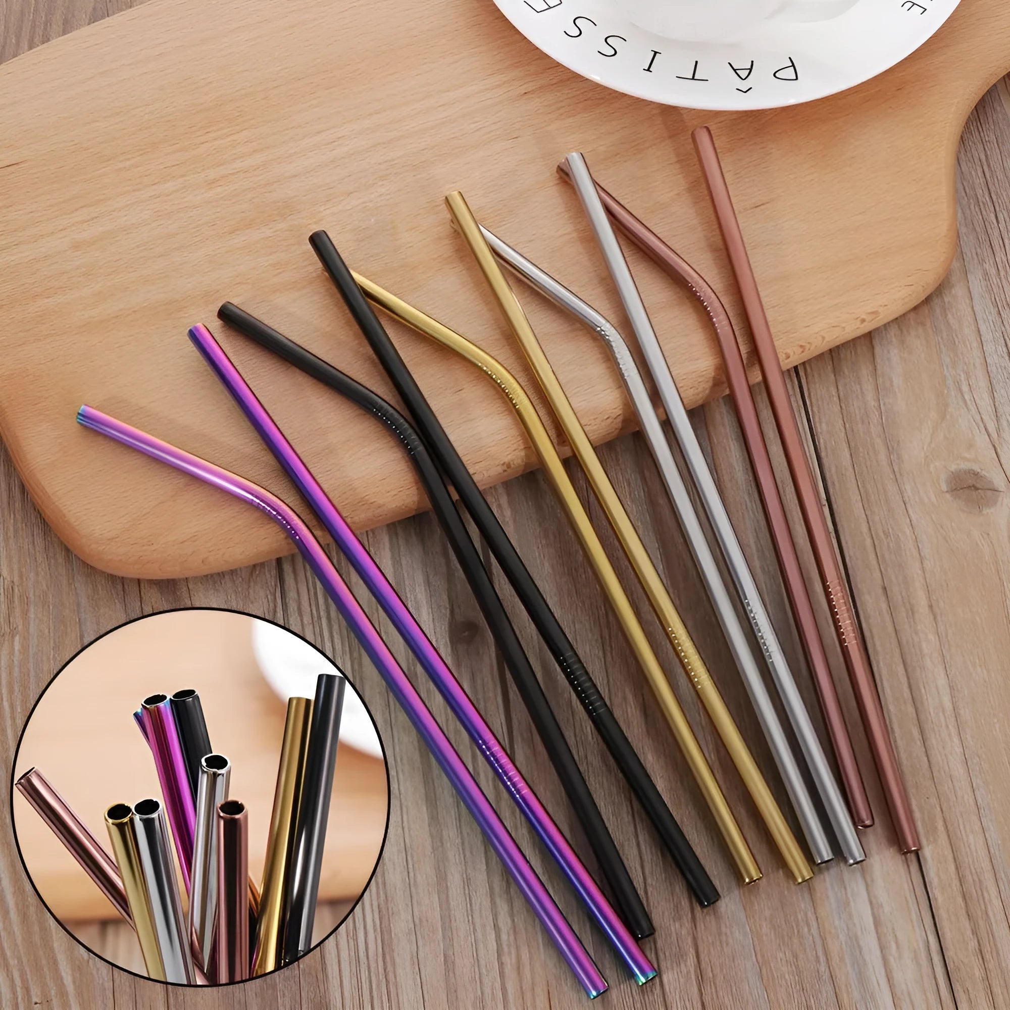 Set of reusable stainless steel straws in different colours and diameters with a cleaning brush.
