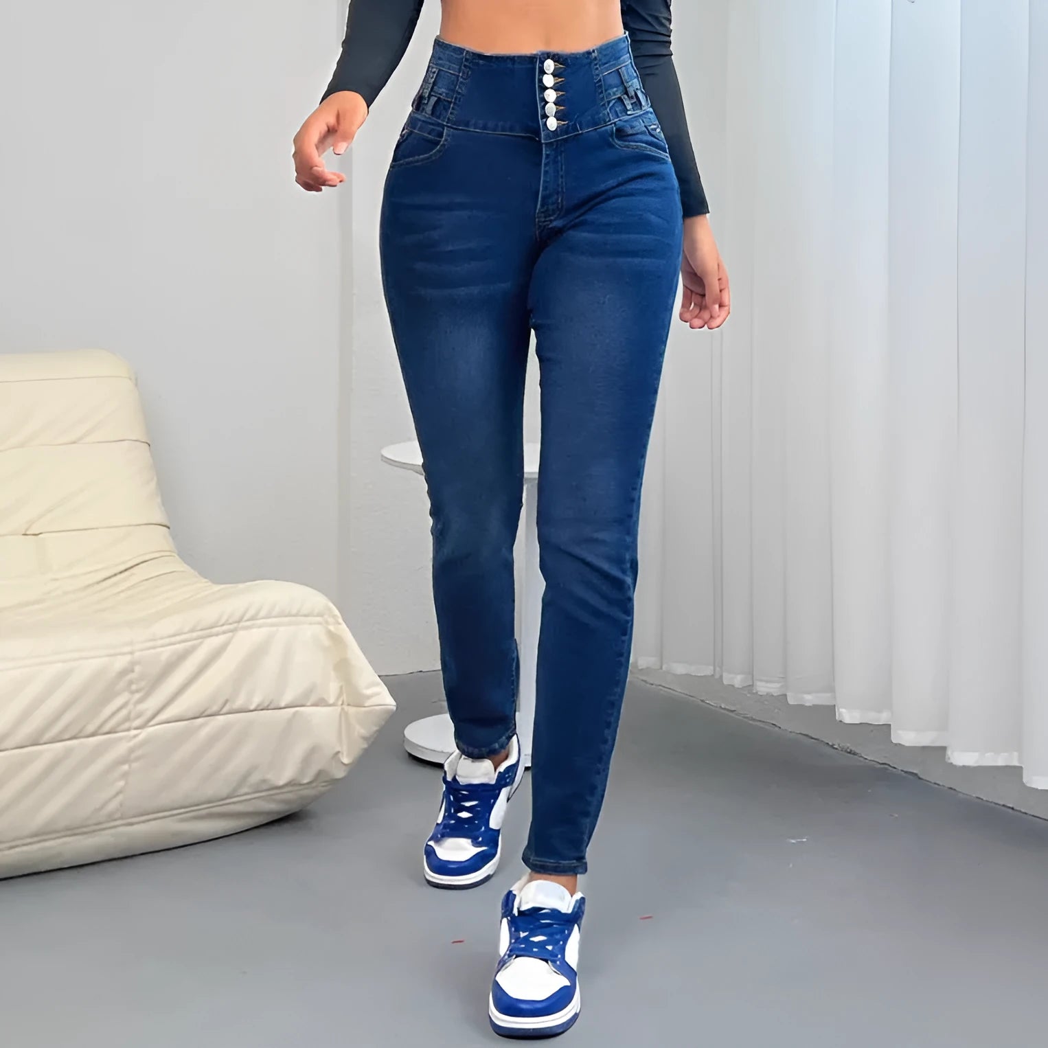 Dark blue women's straight-leg denim jeans with button fly and breast pockets